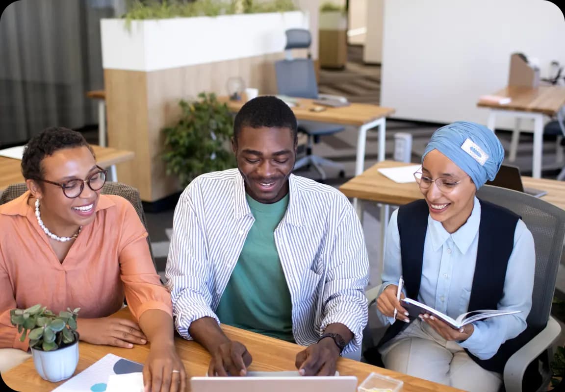 Diverse entrepreneurs collaborating at a table